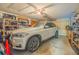 Attached garage with ample storage space and a car at 316 Dahoon Holly Dr, Daytona Beach, FL 32117
