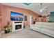 Living room showcasing a fireplace and a large TV at 316 Dahoon Holly Dr, Daytona Beach, FL 32117