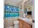 Clean bathroom with a shower/tub and wood vanity at 316 Dahoon Holly Dr, Daytona Beach, FL 32117