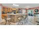 Kitchen boasts an island with seating and modern appliances at 316 Dahoon Holly Dr, Daytona Beach, FL 32117