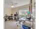 Home office with large window, comfortable chair, and built-in shelving at 316 Dahoon Holly Dr, Daytona Beach, FL 32117