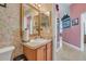 Small bathroom with sink and floral wallpaper at 316 Dahoon Holly Dr, Daytona Beach, FL 32117