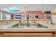 Double kitchen sink overlooking Gathering room at 316 Dahoon Holly Dr, Daytona Beach, FL 32117