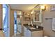 Bathroom features granite vanity and updated fixtures at 2987 S Atlantic Ave # D060, Daytona Beach, FL 32118