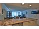 Kitchen with granite countertop and stainless steel appliances at 2987 S Atlantic Ave # D060, Daytona Beach, FL 32118