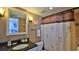 Clean bathroom with granite countertop and shower at 2987 S Atlantic Ave # D060, Daytona Beach, FL 32118