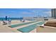Oceanfront patio with shuffleboard and seating at 2987 S Atlantic Ave # D060, Daytona Beach, FL 32118