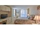 Bright bedroom with built-in cabinets and a comfortable bed at 2987 S Atlantic Ave # D060, Daytona Beach, FL 32118