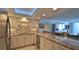 Modern kitchen with granite countertops and stainless steel appliances at 2987 S Atlantic Ave # D060, Daytona Beach, FL 32118