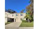 Two story townhome with attached garage, landscaping, and palm tree at 1630 Primo Ct, Daytona Beach, FL 32117