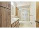 Clean bathroom with shower/tub combo and wood vanity at 10170 Sw 96Th Ct, Ocala, FL 34481