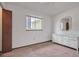 Bedroom with dresser, window, and built-in closet at 10170 Sw 96Th Ct, Ocala, FL 34481