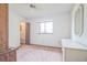Bright bedroom with carpet, ceiling fan, and ample closet space at 10170 Sw 96Th Ct, Ocala, FL 34481