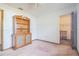 Bedroom with wood shelving unit and access to a walk-in closet at 10170 Sw 96Th Ct, Ocala, FL 34481