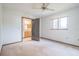 Well-lit bedroom featuring a private bathroom access at 10170 Sw 96Th Ct, Ocala, FL 34481