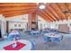 Spacious community room with tables and chairs, a fireplace, and high ceilings at 10170 Sw 96Th Ct, Ocala, FL 34481