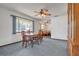 Dining room with wood table and chairs, and access to the living room at 10170 Sw 96Th Ct, Ocala, FL 34481