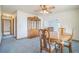 Formal dining room with wood hutch and table, offering ample space at 10170 Sw 96Th Ct, Ocala, FL 34481