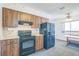 Kitchen with black appliances and wood cabinets at 10170 Sw 96Th Ct, Ocala, FL 34481