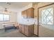 Kitchen with built-in breakfast nook and wood cabinets at 10170 Sw 96Th Ct, Ocala, FL 34481