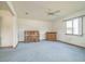 Living room features a piano, ceiling fan, and ample natural light at 10170 Sw 96Th Ct, Ocala, FL 34481