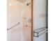 Shower stall with grab bars and tiled walls at 10170 Sw 96Th Ct, Ocala, FL 34481