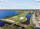 Aerial view of golf course, lake, and residential area at 4345 Heath Land Ln, Lake Wales, FL 33859