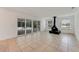 Living room with fireplace and sliding glass doors leading to patio at 660 Saxon Blvd, Deltona, FL 32725
