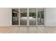 View of a screened-in patio accessible through sliding glass doors at 660 Saxon Blvd, Deltona, FL 32725