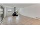 Spacious living room featuring a fireplace and tile flooring at 660 Saxon Blvd, Deltona, FL 32725