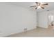 Bright bedroom with tile floors, ceiling fan and access to a bathroom at 660 Saxon Blvd, Deltona, FL 32725