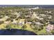 Aerial view showing home's location on waterfront lot with large backyard at 660 Saxon Blvd, Deltona, FL 32725