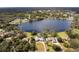 Aerial view of property near lake and other homes at 660 Saxon Blvd, Deltona, FL 32725