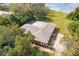 Aerial view highlighting home's brick exterior and expansive backyard at 660 Saxon Blvd, Deltona, FL 32725