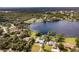 Aerial view showcasing the property's waterfront setting at 660 Saxon Blvd, Deltona, FL 32725