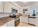 Bright kitchen featuring stainless steel appliances and ample counter space at 660 Saxon Blvd, Deltona, FL 32725