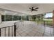 Covered patio with lake view and ceiling fan at 660 Saxon Blvd, Deltona, FL 32725
