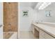 Clean bathroom with a large vanity and shower/tub combination at 660 Saxon Blvd, Deltona, FL 32725