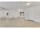 Open living room with tile floors and a view to another room at 660 Saxon Blvd, Deltona, FL 32725