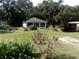 Front of house with yard and driveway at 950 S Parsons Ave, Deland, FL 32720