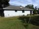 Rear view of a white single story house at 950 S Parsons Ave, Deland, FL 32720