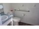 Bathroom with toilet, sink, and grab bars at 950 S Parsons Ave, Deland, FL 32720