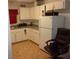 Kitchen with white cabinets and appliances at 950 S Parsons Ave, Deland, FL 32720
