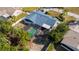 Aerial view of house with large, screened-in pool at 1020 Hanford Dr, Deltona, FL 32738