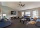 Spacious living room featuring a large TV and ample seating at 1020 Hanford Dr, Deltona, FL 32738