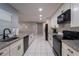 Modern kitchen with granite countertops and stainless steel appliances at 1020 Hanford Dr, Deltona, FL 32738