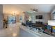 Living room with blue couches, large TV, and view of pool at 1020 Hanford Dr, Deltona, FL 32738
