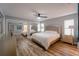 Spacious main bedroom with plush bed and mirrored closet at 1020 Hanford Dr, Deltona, FL 32738