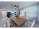 Bright dining room featuring wooden table and access to patio at 1020 Hanford Dr, Deltona, FL 32738