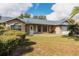 Brick house with attached garage and landscaping at 1020 Hanford Dr, Deltona, FL 32738